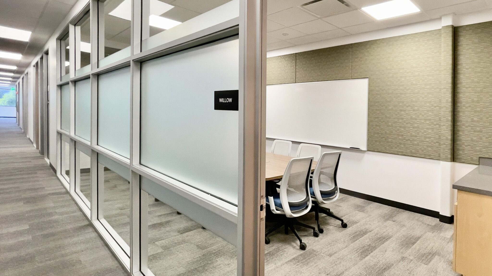 Conference room with privacy glass and hallway