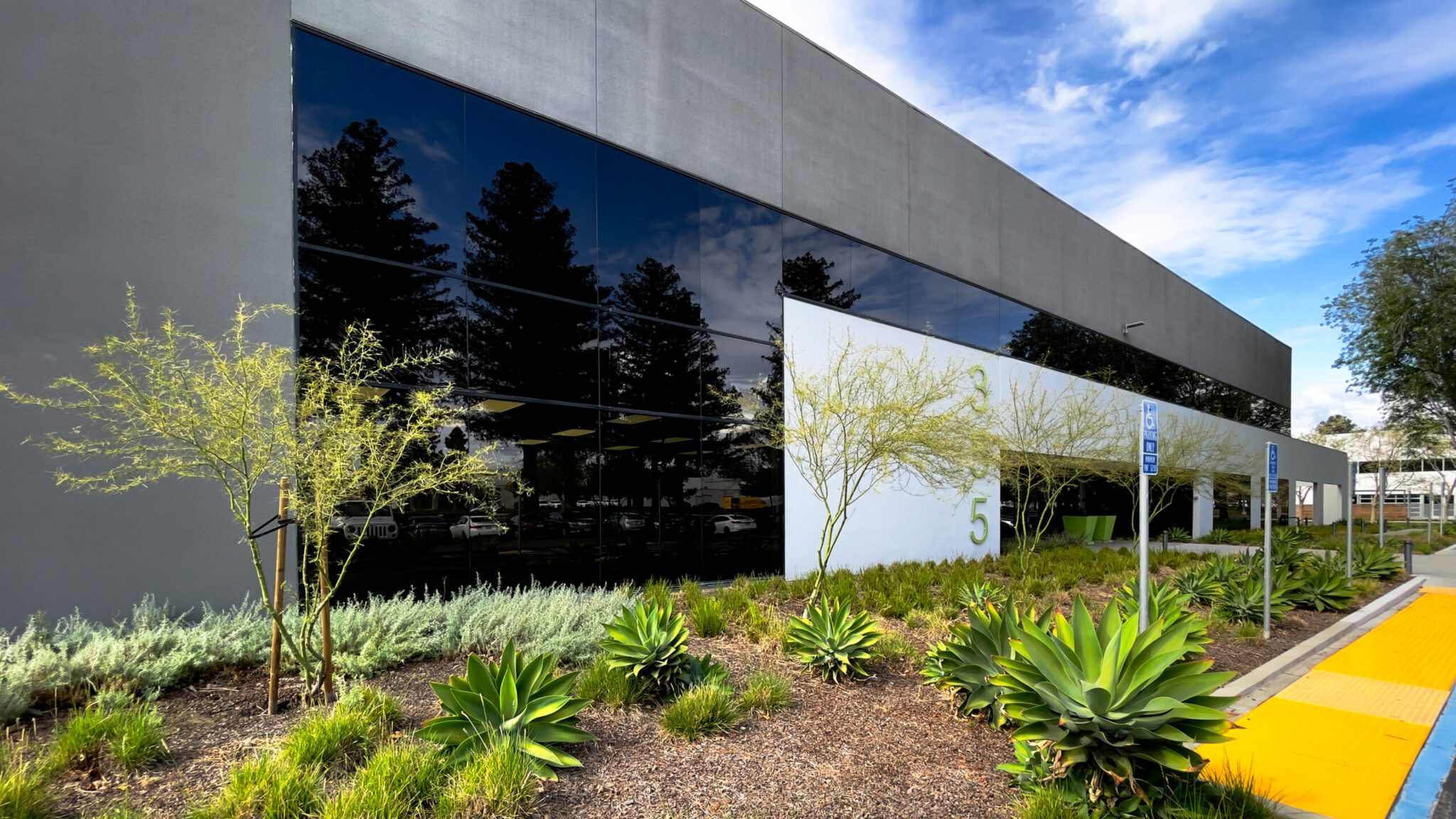 Slate and Glass Front Façade with landscaping and ADA access 
